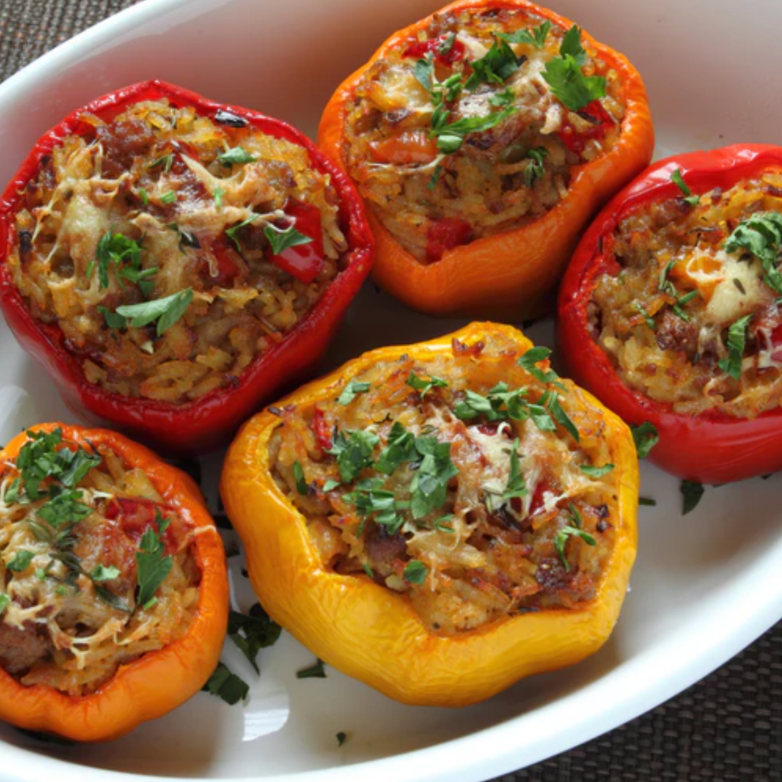 5 stuffed peppers in a dish
